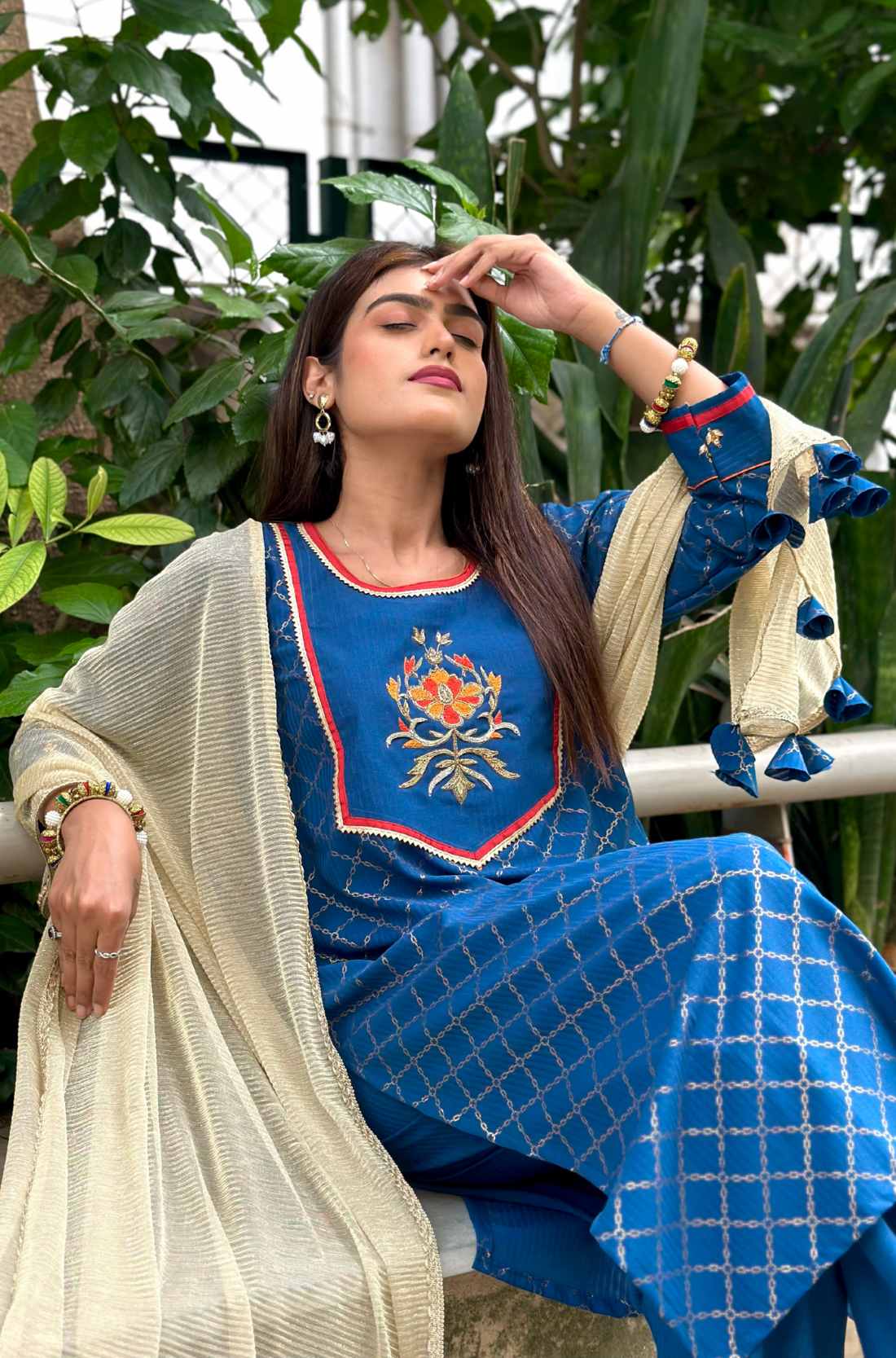 Sitting pose showcasing front View – Blue Crepe hand-embroidered suit set