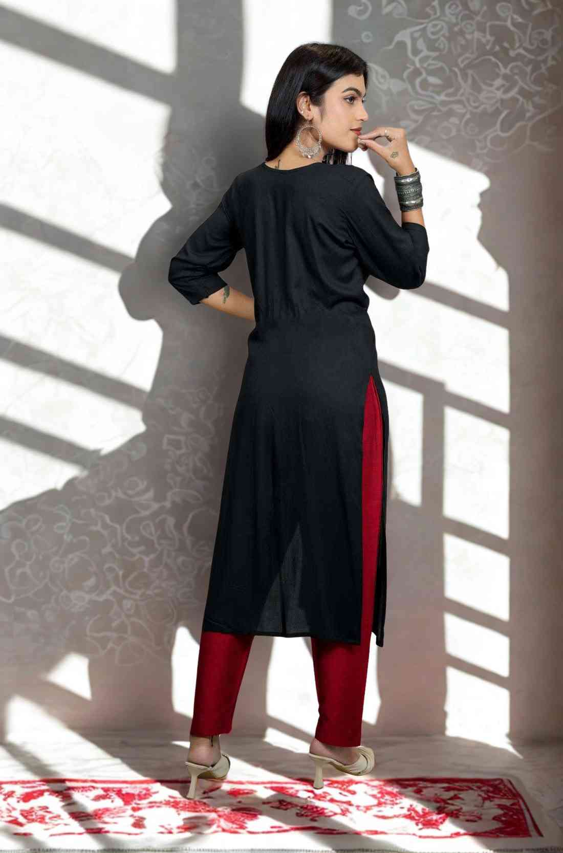 Black hand embroidery and block print a line kurti view from the back.