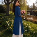 Rear side profile of an indigo cotton hand block print kurta featuring a calf-length silhouette and side slits.