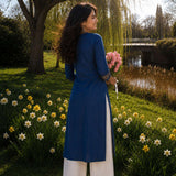 Back view of an indigo pure cotton straight-fit kurta with three-quarter sleeves and side slits.