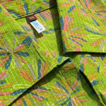Close-up of the collar neckline showcasing the Jaipur floral print and white Kantha stitch detailing on the lime green pure cotton dress.