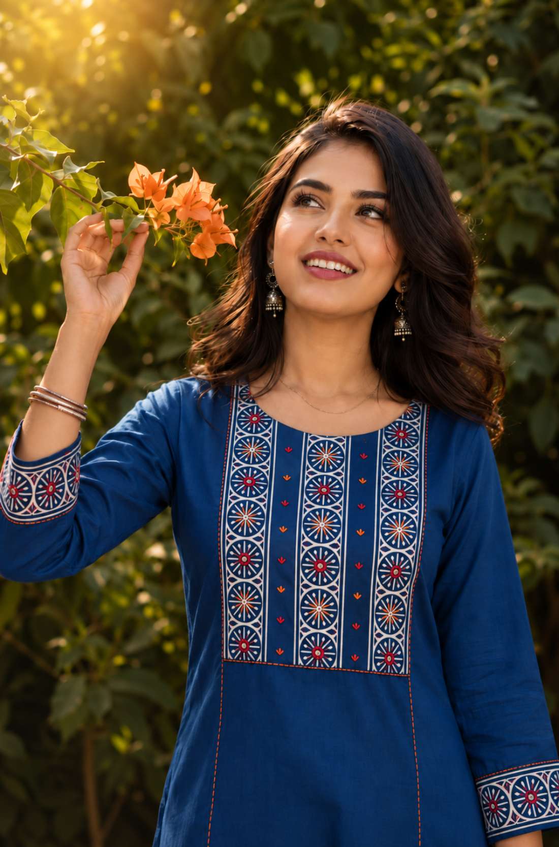 Close-up of the hand block printed yoke with decorative mirror work on an indigo pure cotton kurta.