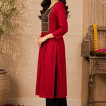Side view of a maroon rayon A-line kurta showing its flared silhouette and three-quarter sleeves