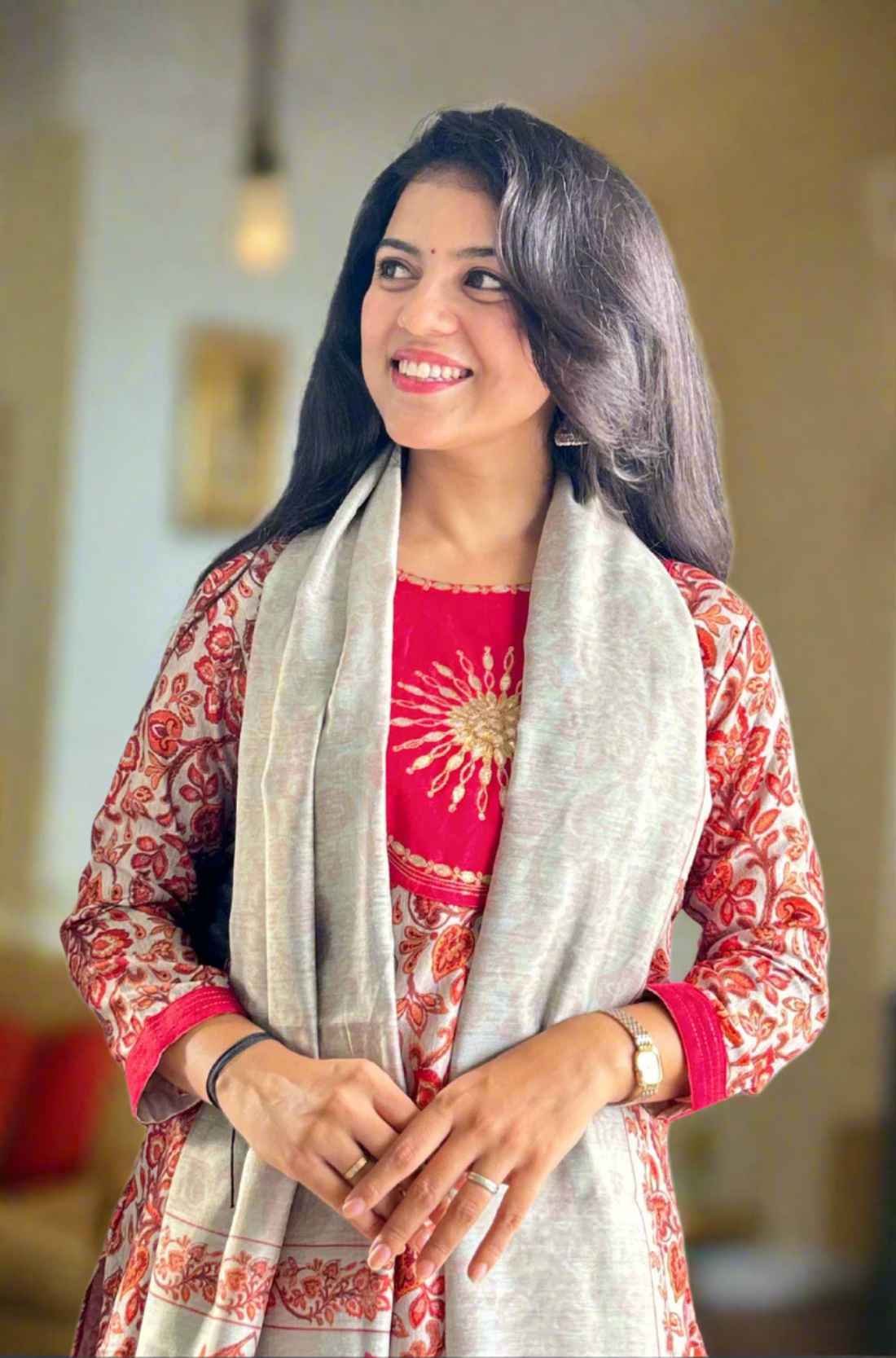 Red printed kurta set with pants and circle design.