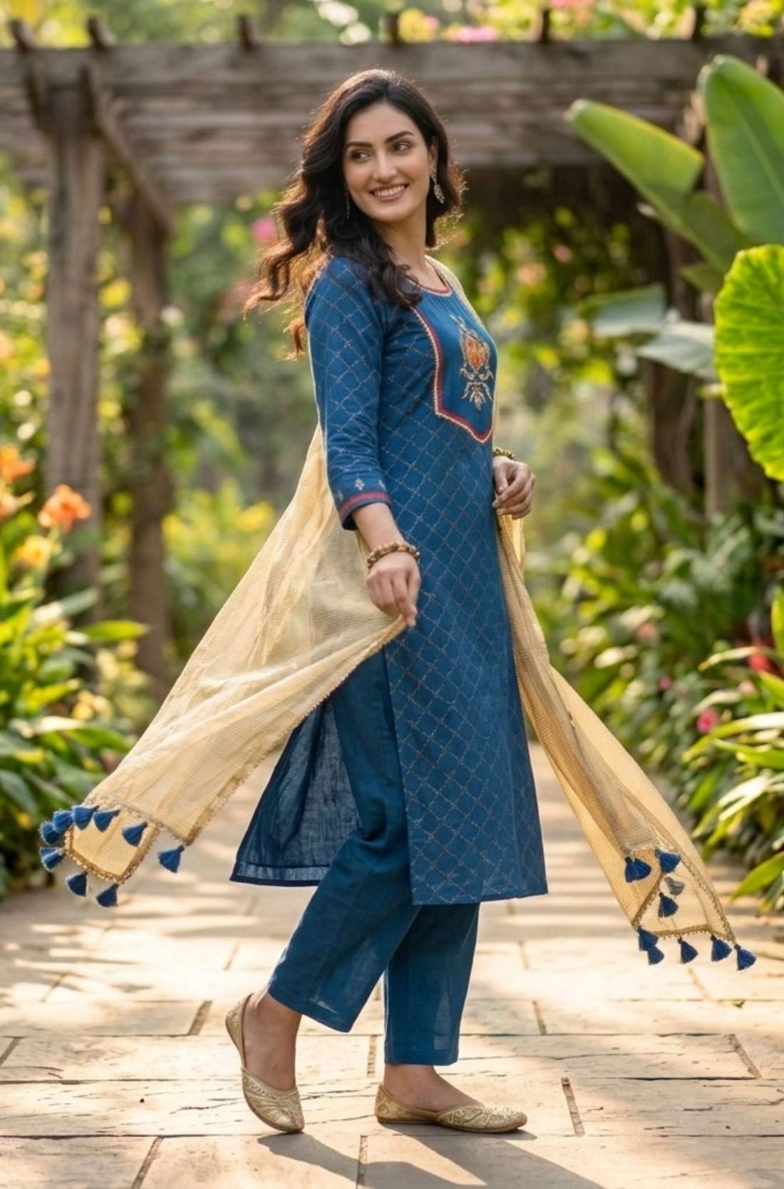 Side profile of the royal blue crepe kurta set showing straight silhouette, matching pants and elegant styling.