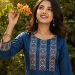 Close-up of the hand block printed yoke with decorative mirror work on an indigo pure cotton kurta.