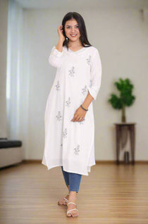 Women Standing wearing White Pure Cotton Kurta Showing the front of the kurta 
