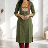 Full front view of women's dark green cotton kurti featuring a hand block print patch yoke, three-quarter sleeves, straight fit, and calf-length design styled with maroon pants.