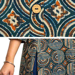 Close-up detail of Women's Geometric Hand Block Print Pure Cotton Shirt Style Kurti in Bottle Green and Rust featuring handcrafted geometric block print, wooden button placket, premium pure cotton fabric, and side slit for comfortable everyday wear.