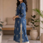 Side profile of women's indigo hand block print cotton kurta featuring a straight fit, side slits, contrast sleeve cuffs, and three-quarter sleeves.