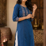 Full-length indigo pure cotton hand block print kurta paired with white trousers, suitable for office and everyday wear.