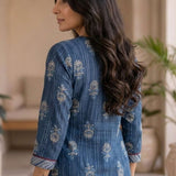 Back view of women's indigo pure cotton straight-fit kurta with white floral hand block print motifs, three-quarter sleeves, side slits, and a clean back design.