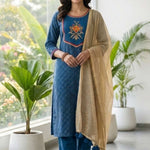 Full-length indoor view of the royal blue crepe kurta set with matching trousers and gold tassel dupatta.