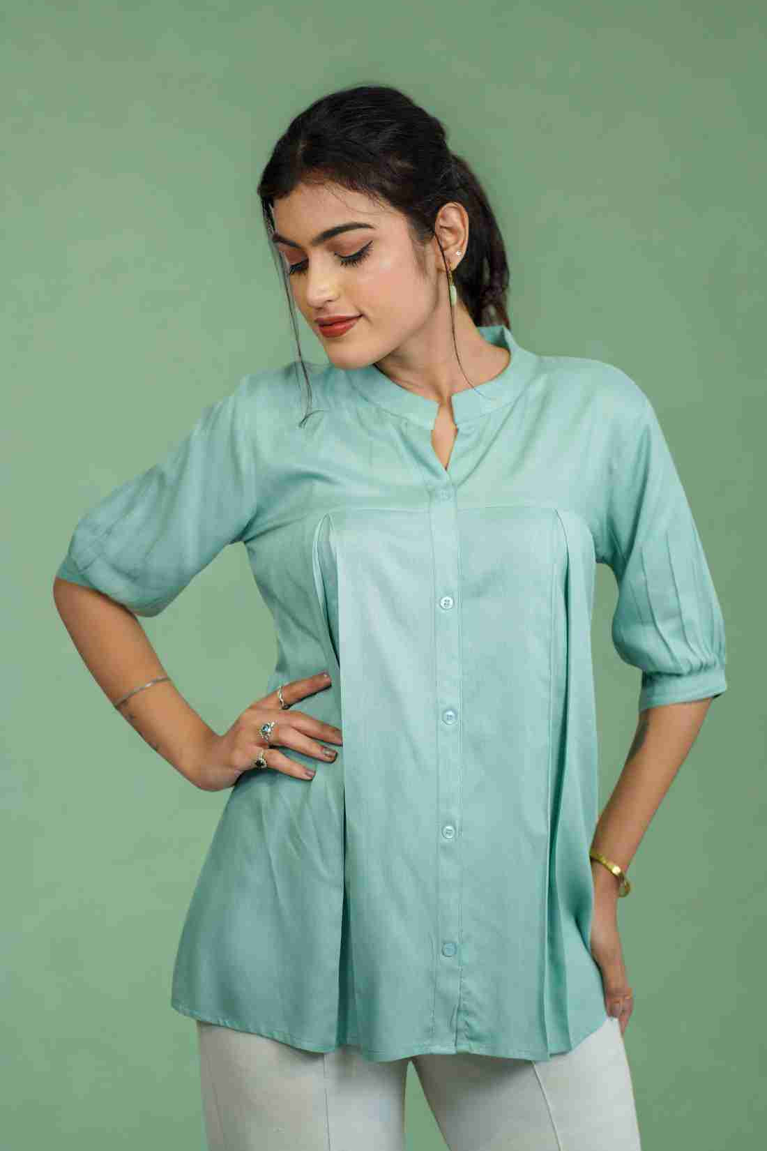 Half-length front view of women's sea green rayon shirt featuring a mandarin collar, button-down front, subtle pleats, and relaxed fit for office and casual styling.