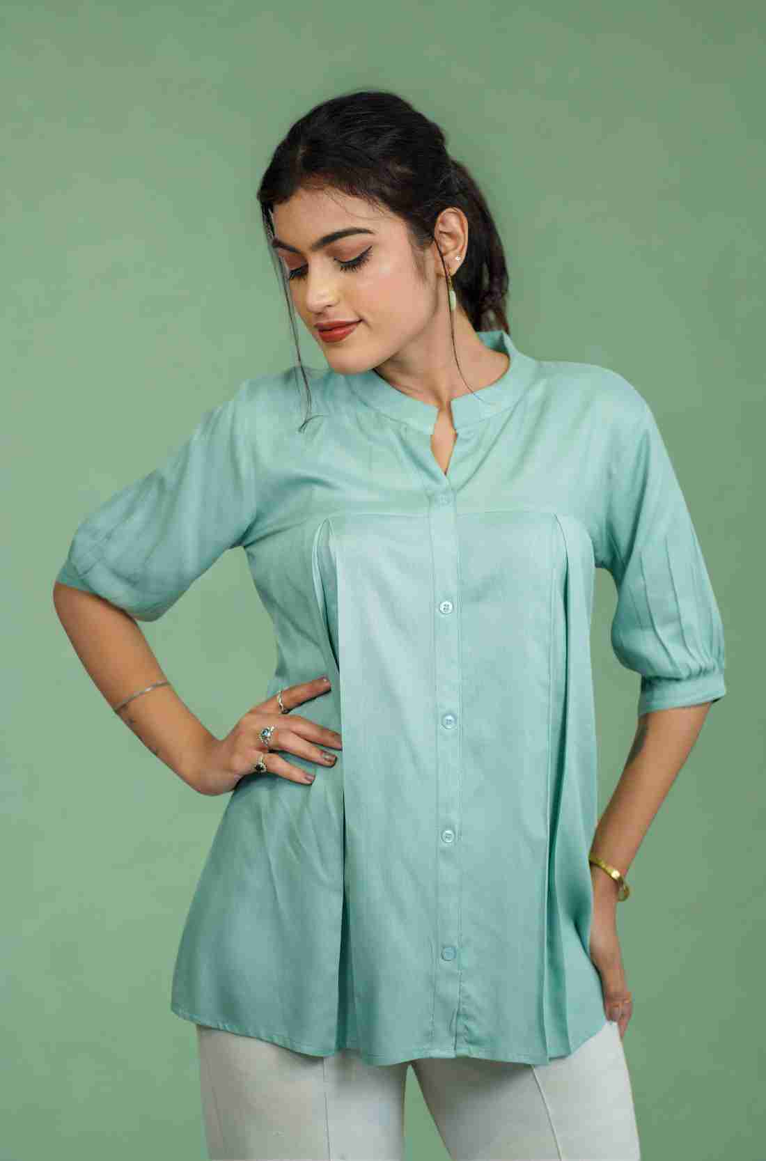 Half-length front view of women's sea green rayon shirt featuring a mandarin collar, button-down front, subtle pleats, and relaxed fit for office and casual styling.