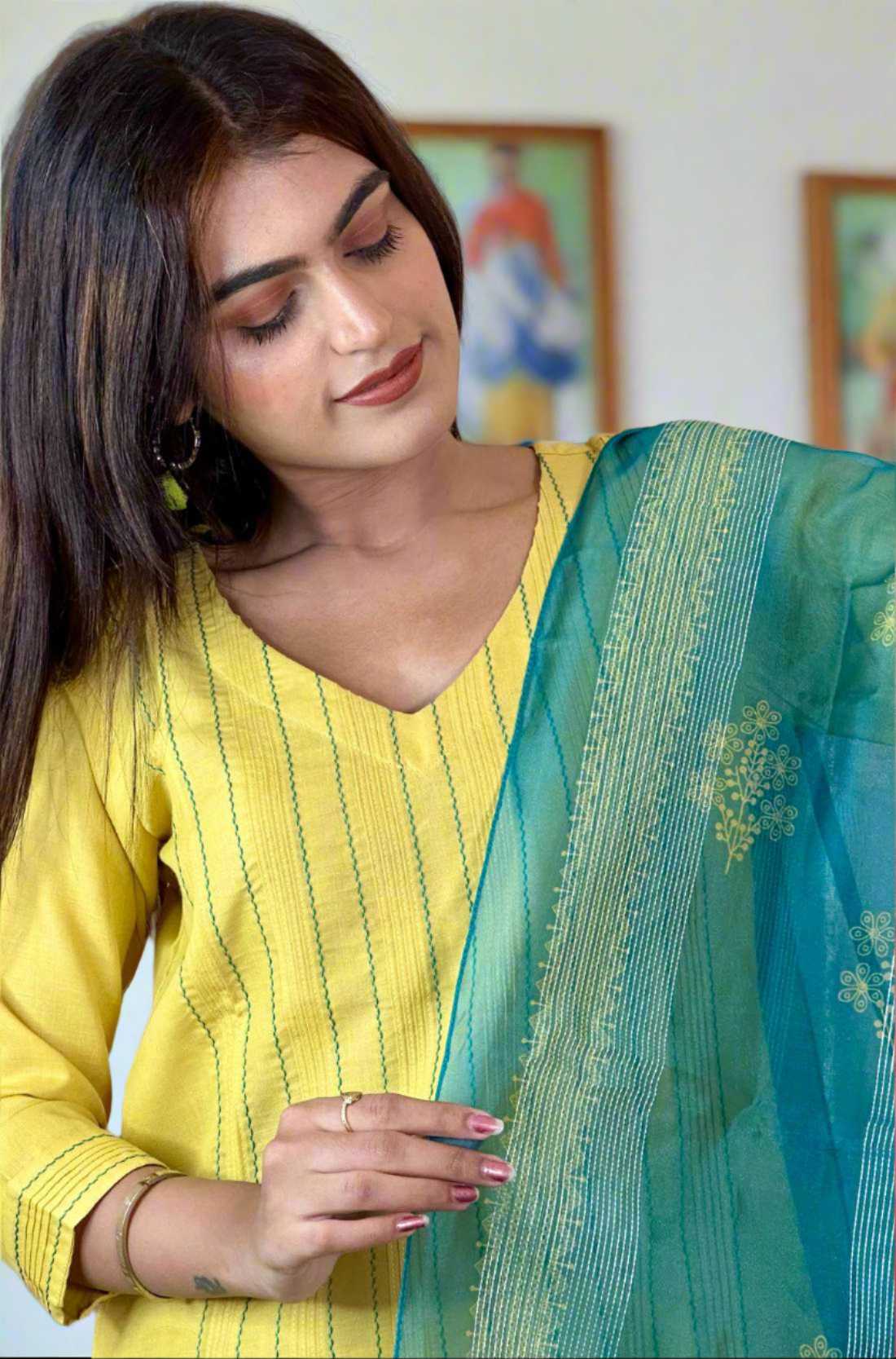 Model showing blue – dupatta and kurta detailing.