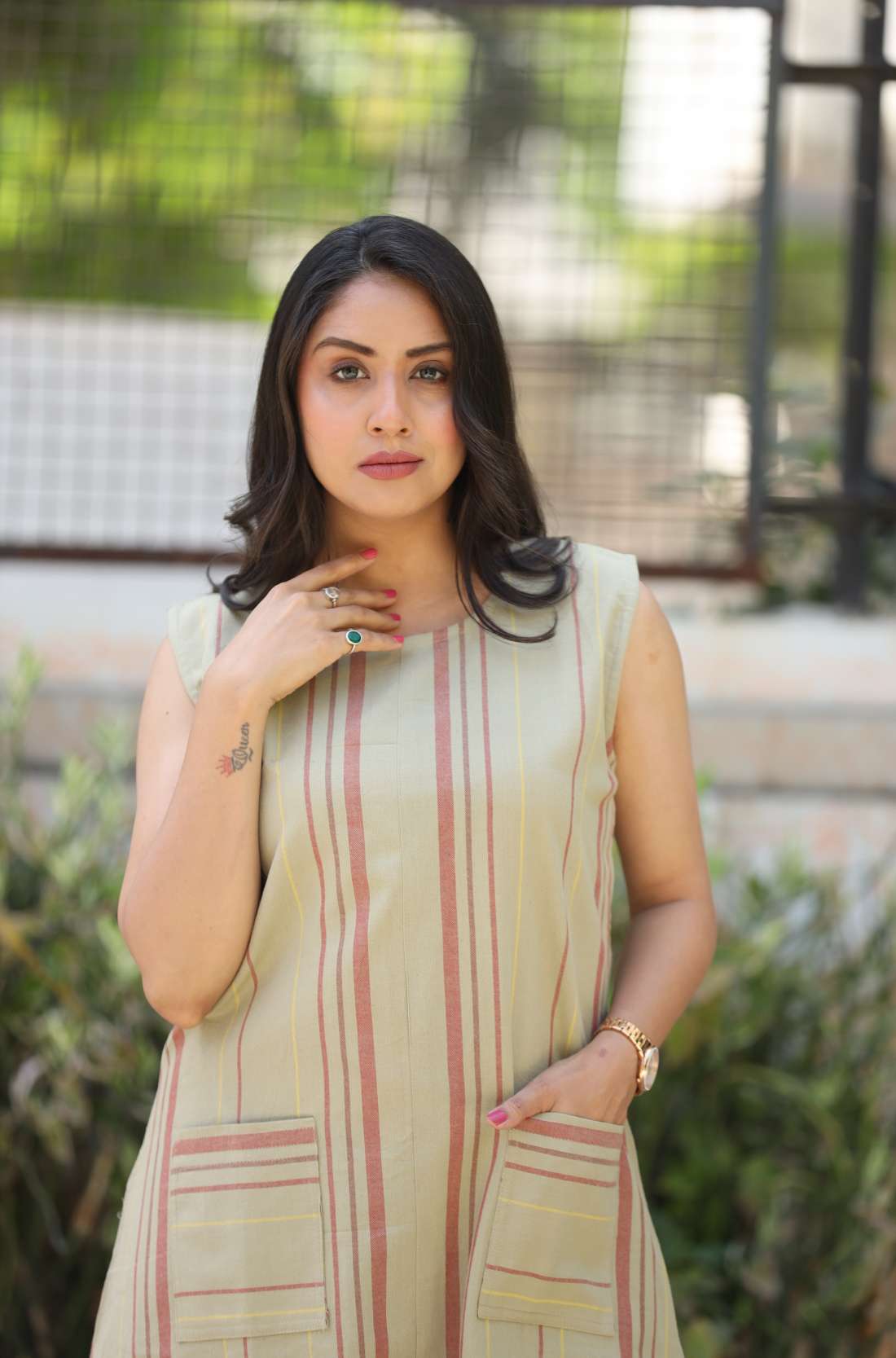 Sleeveless beige striped A-line kurti – front view
