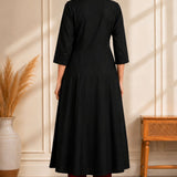 Back view of black A-line rayon kurta for women with 3/4 sleeves and flared fit