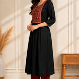 Side view of black hand embroidered A-line rayon kurta for women with block print yoke