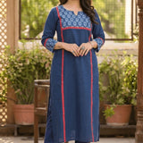 Full length front view of a woman posing gracefully in a blue ethnic wear set with floral print details.