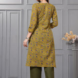 Back view of the mustard yellow straight fit cotton floral kurta set highlighting the clean print alignment