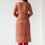 Back view of the straight fit cream pashmina silk kurta suit showcasing the fall of the pink printed chanderi dupatta