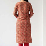 Back view of the straight fit cream pashmina silk kurta suit showcasing the fall of the pink printed chanderi dupatta