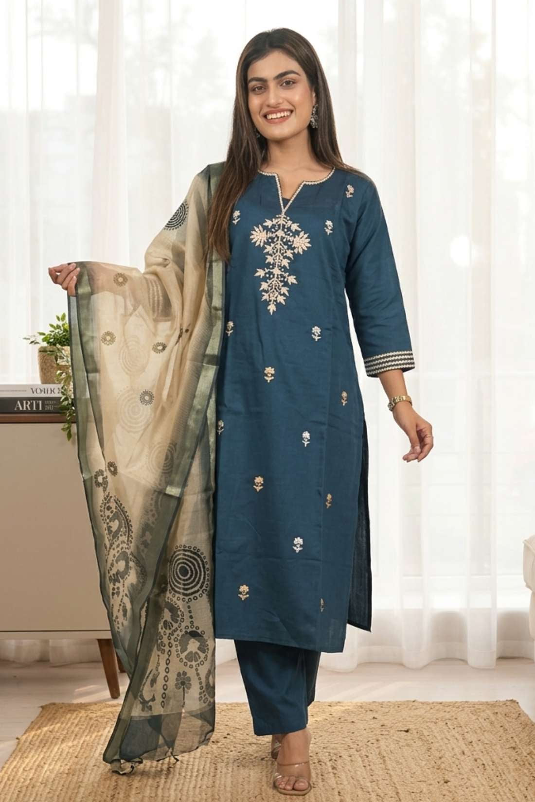 Front full length view of a model in a dark blue silk kurta set with aari embroidery and an chanderi dupatta