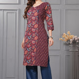 Side profile view of a model in a deep mudberry purple floral printed cotton ethnic suit showcasing the regular fit