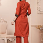 Back view of the straight fit rust orange cotton straight kurta set showing the comfortable trousers and clean back silhouette