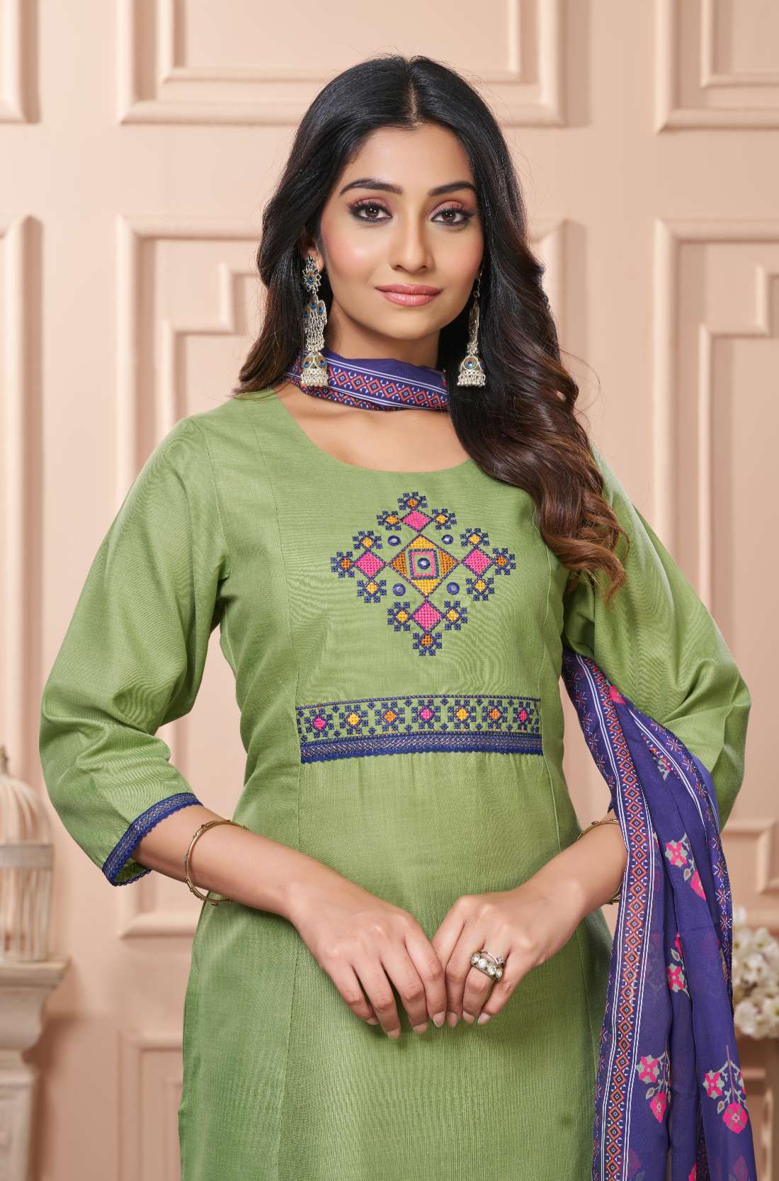 Light green kurta set for women with cross stitched embroidery on front 