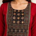 Close-up of hand embroidery, mirror work and block print on maroon rayon kurta for women