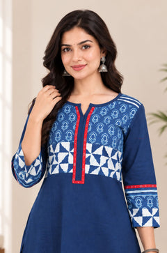 Close-up view highlighting the notch neck design, red trim, and block-printed pattern on the yoke and sleeves of the Indigo cotton kurti.