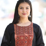 Close-up pose in black embroidered A-line Kurta