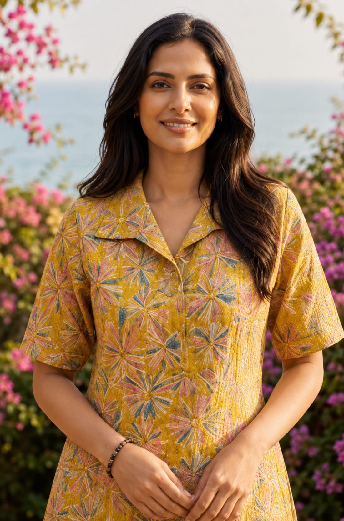 Close-up of ochre yellow printed cotton frock style kurti with collar neck and elbow sleeves