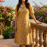 Ochre yellow printed cotton frock style kurti with Jaipur floral print, collar neck and flared hem, front view