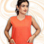 Close-up of pocket on sleeveless orange kurti