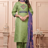 A full length presentation of a green cotton ethnic suit set displaying vibrant cross stitch embroidery details along the front panel, styled with straight pants and a printed dupatta