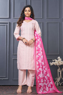 Front full length view of a model wearing a pink pure cotton kurta set featuring vertical pintucks and vibrant multicolor thread embroidery on the neckline, paired with straight trousers and a matching printed dupatta