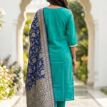 Rear view of the rama green embroidered straight-fit kurta set, showcasing the clean silhouette, straight trousers, and matching dupatta styling from behind.