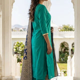 Side profile view of the rama green straight-fit embroidered kurta set, displaying the clean drape of the fabric and the elegant fall of the matching printed dupatta.