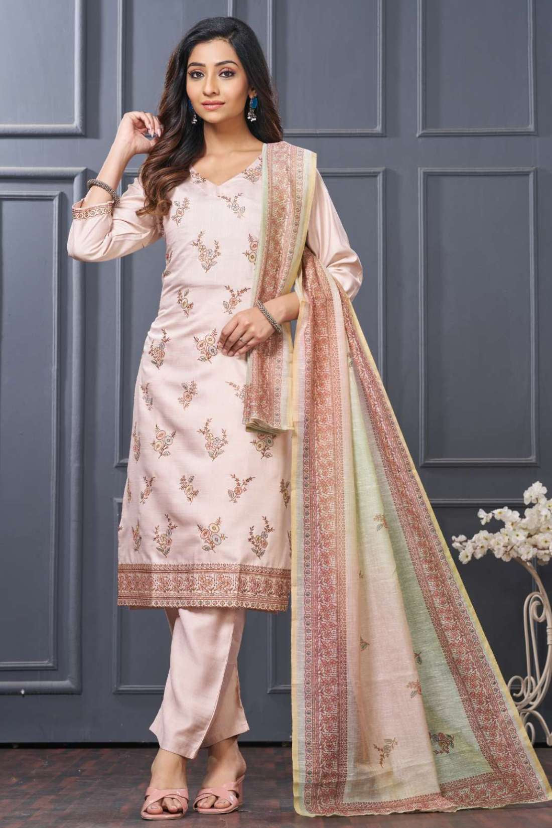 Front full length view of a model in a premium pink and green scalloped embroidered silk 3 piece kurta set showcasing elegant gold thread embroidery on the neckline, paired with straight pants and a matching dupatta.