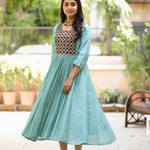 Sea green flared kurti showing A-line silhouette, gathered waist and flared hem
