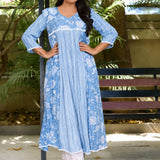 Sky blue white muslin flared kurti with floral geometric print, sitting view
