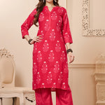 Front full length view of a model wearing a rani pink straight fit floral print cotton kurta set with matching chevron pants and a printed dupatta