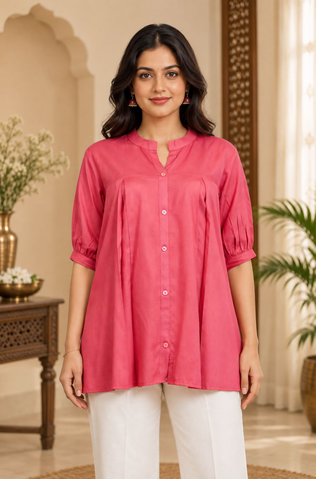 Close-up front view showing front button closure, mandarin collar, and front pleats of the dark peach rayon top.