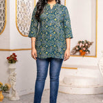 Women's Geometric Hand Block Print Pure Cotton Shirt Style Kurti in blue and olive green featuring a stand collar, wooden button placket, 3/4 sleeves, and a relaxed hip-covering silhouette paired with blue jeans.