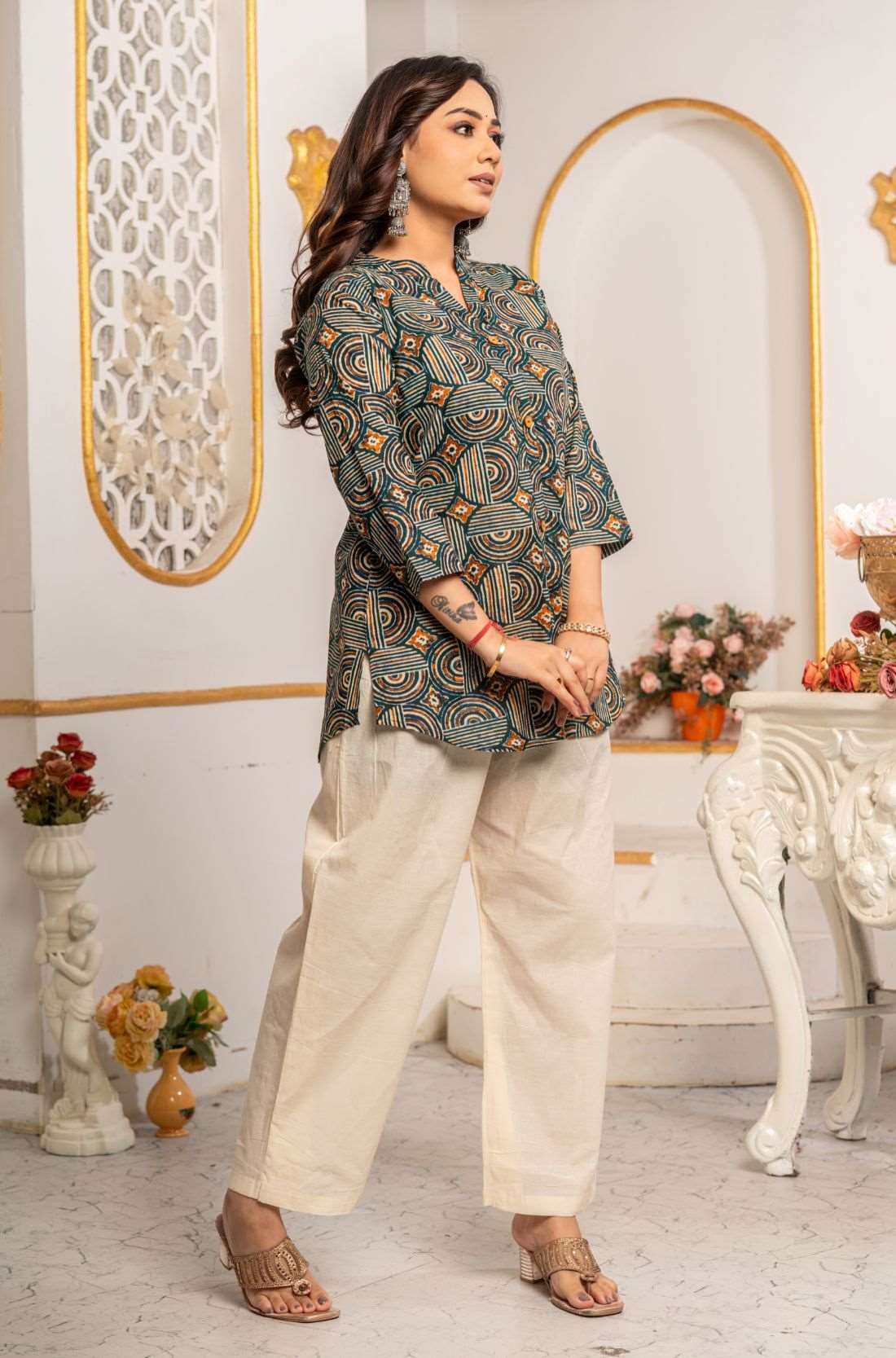 Side view of Women's Geometric Hand Block Print Pure Cotton Shirt Style Kurti in forest green and rust orange with handcrafted geometric print and relaxed fit.