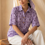 Front view of a women's lavender floral hand block print cotton shirt with relaxed fit and short sleeves.