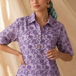 Front close-up of a women's lavender floral hand block print cotton shirt with wooden buttons and classic collar.